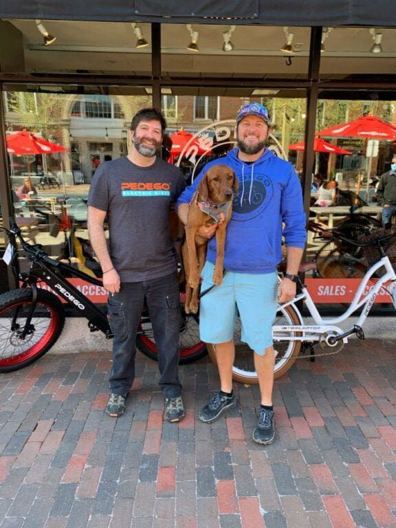 Owner's of Pedego Portsmouth Marc and Joe outside of their storefront.