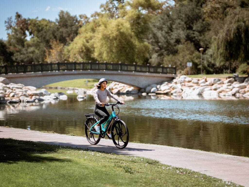 Wpman enjoying a ride on her Pedego Avenue Electric Bike along the river 