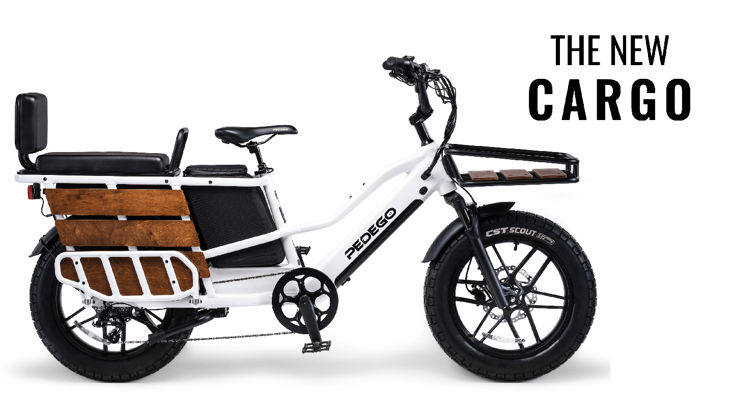 Pedego- Electric cargo bike with white frame and wood paneling on the sides, labeled "radego," parked against a plain background with text "the new cargo" at the top right.