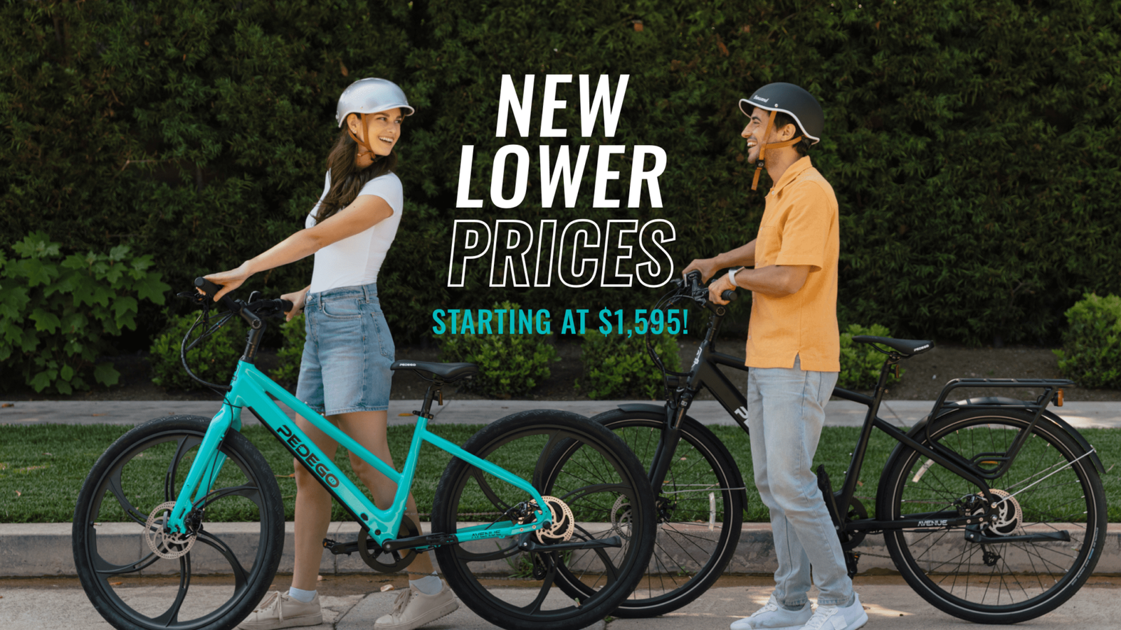 Pedego- Two people in helmets stand beside their bicycles, smiling at each other. Text overlay reads, "New Lower Prices Starting at $1,595!" in a bold font.